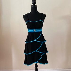 Black party dress with blue ribbon and hem embellishments size small.